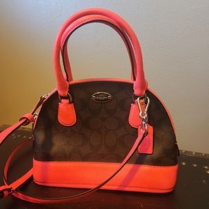 Coach monogram bag with neon pink trim